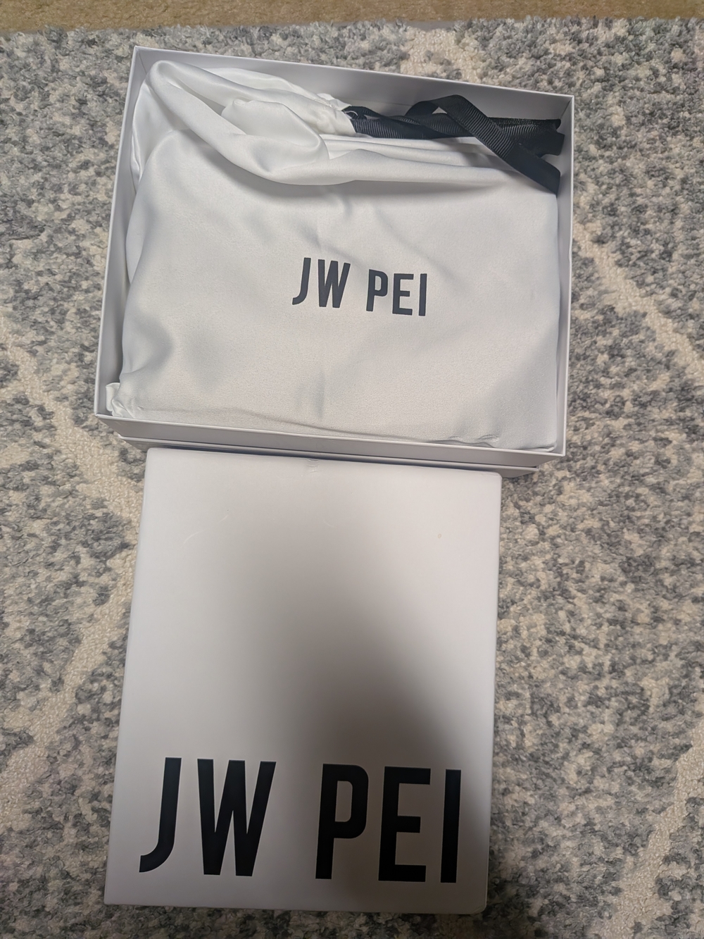 JW PEI White Crossbody Pouch with Black Strap